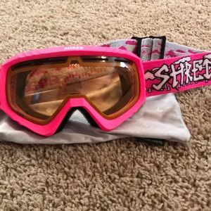 Pink SHRED ski goggles.